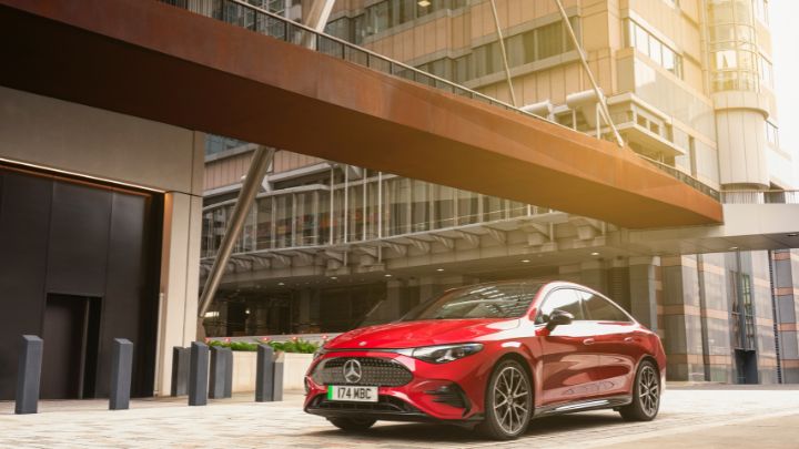 Red Mercedes-Benz Vehicle Parked Beside Office Block