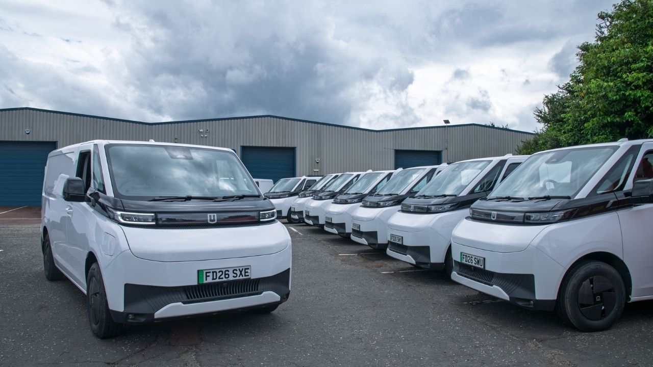 Fleet of White Farizon Vans Parked in Car Park