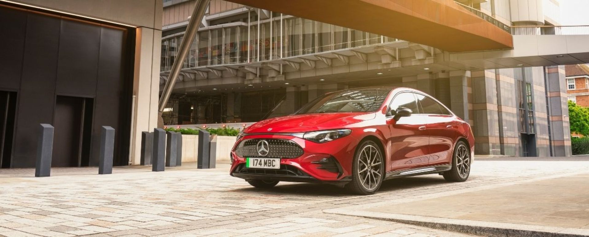 Red Mercedes-Benz Vehicle Parked Amongst Office Block