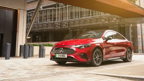 Red Mercedes-Benz Vehicle Parked Amongst Office Block