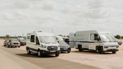 A Range Of Vans And SUVs On A Wide Road