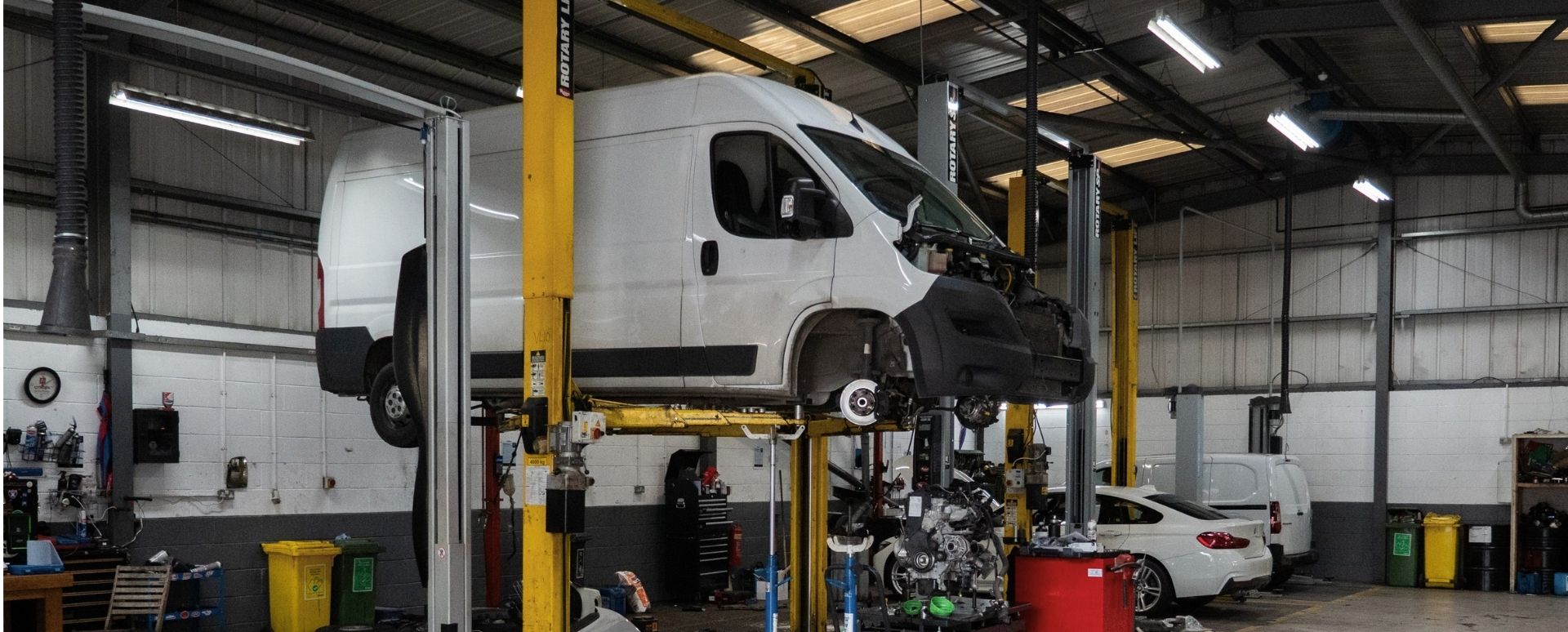 White Van On a Workshop Lift
