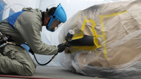 person repairing vehicle