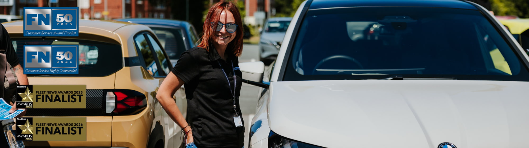 Woman Stood Next to Grey BMW Vehicle
