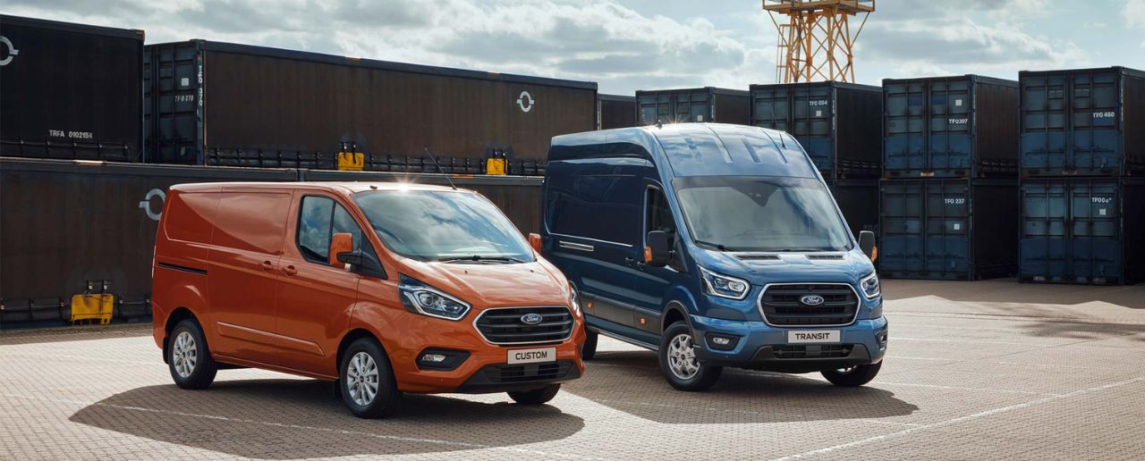 1 orange and 1 blue ford van