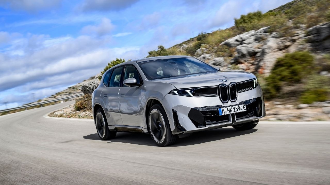Silver BMW iX3 Driving on Remote Road