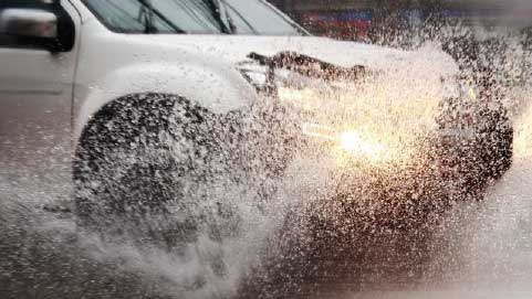 Car Driving Through Floodwater