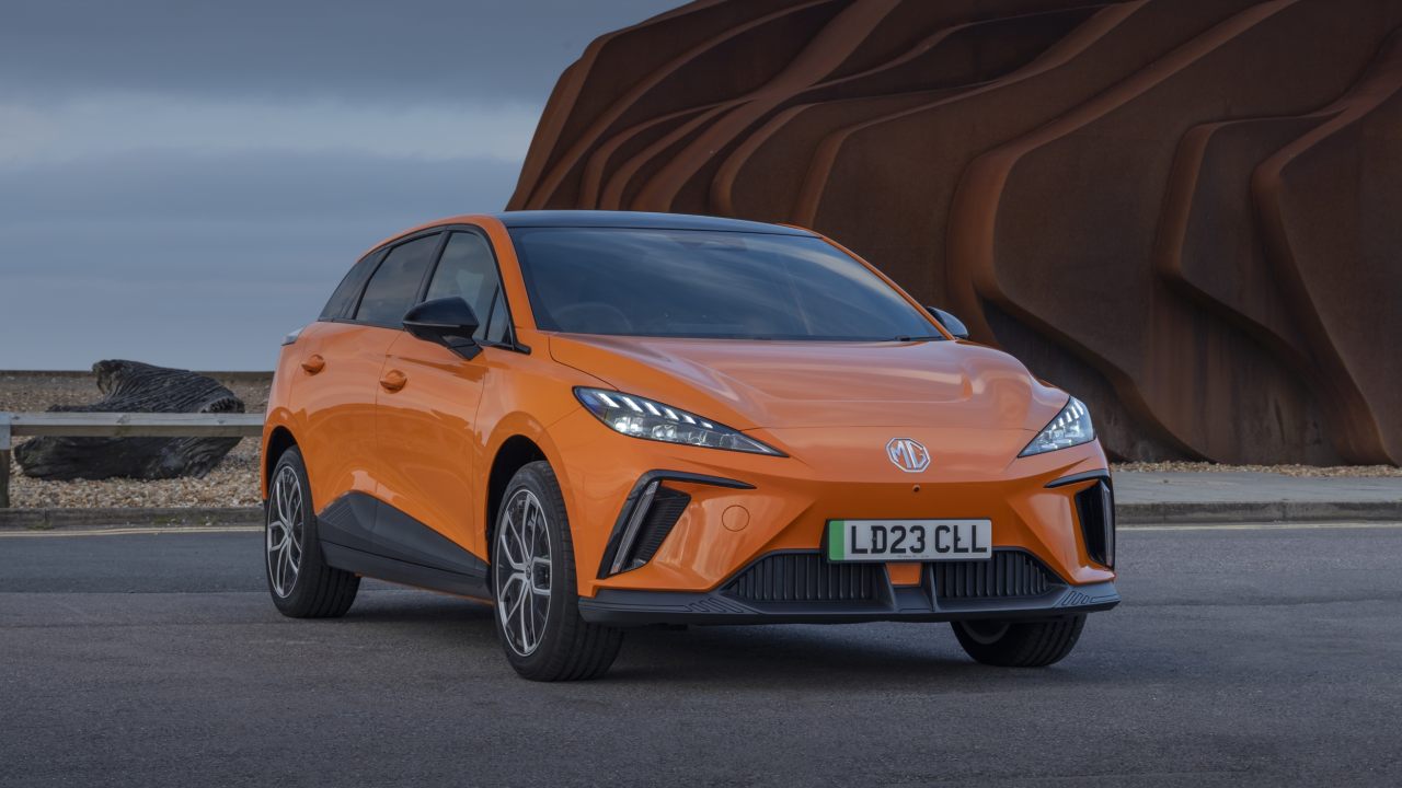 Orange MG4 EV Exterior Front Static on a Beach