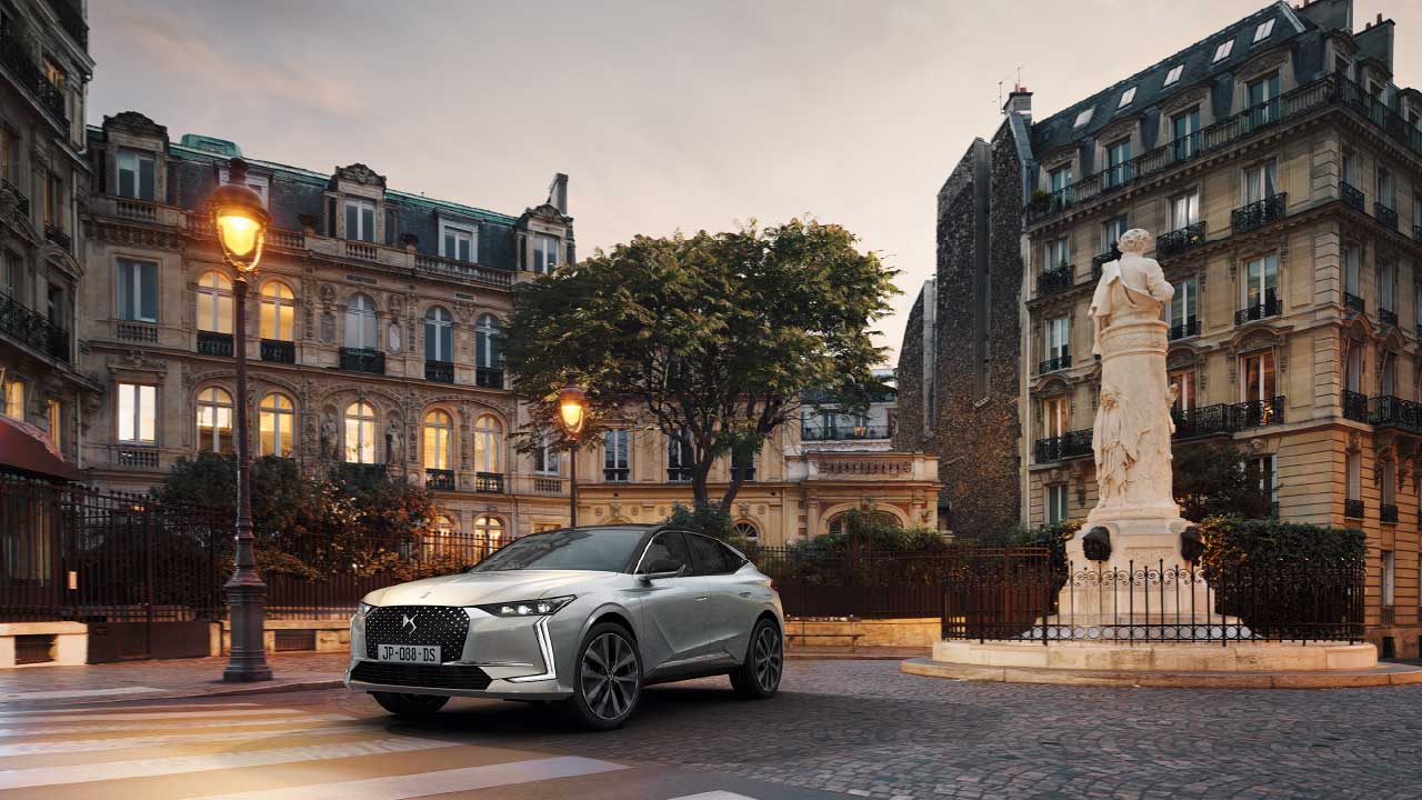 Car Parked In Front Of Buildings