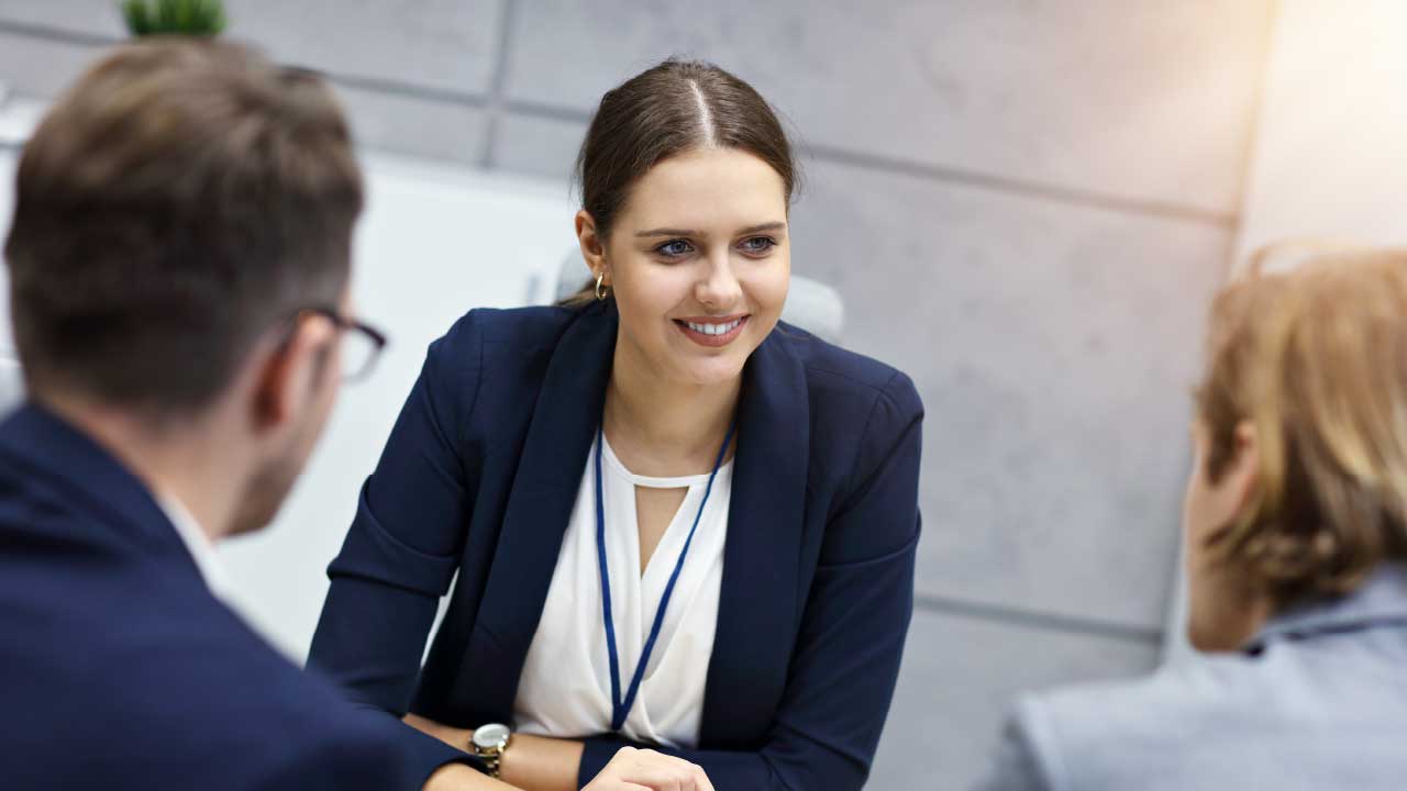 Woman Talking To Two People