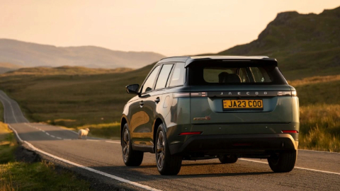 Jaecoo Vehicle Driving on Country Road Rear View